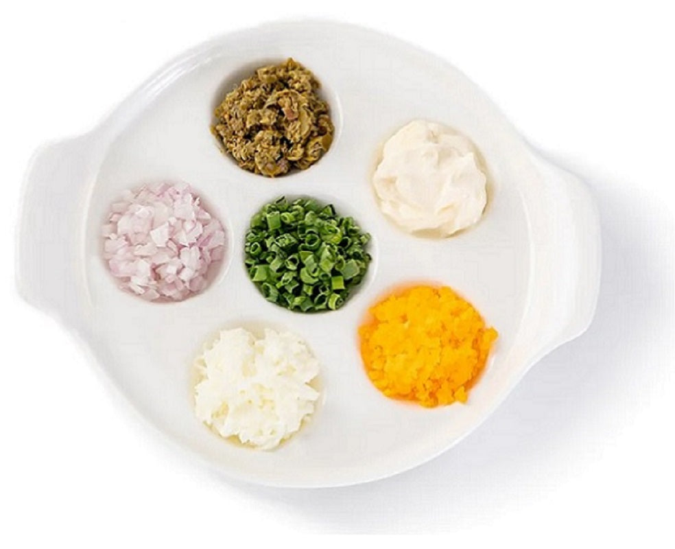 Classic Caviar Condiments, chopped chives, hard-boiled eggs, capers, crème fraîche and diced white onions